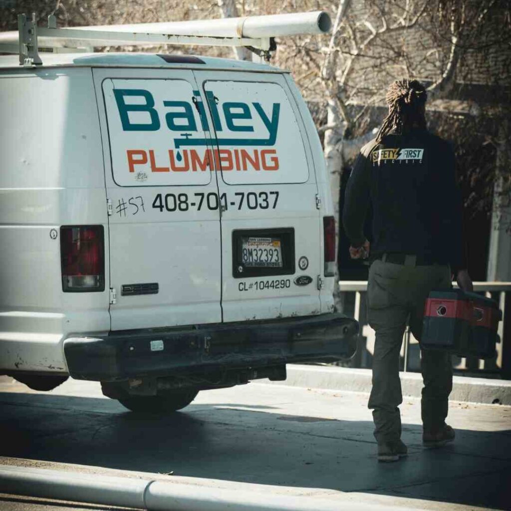 plumber walking towards van