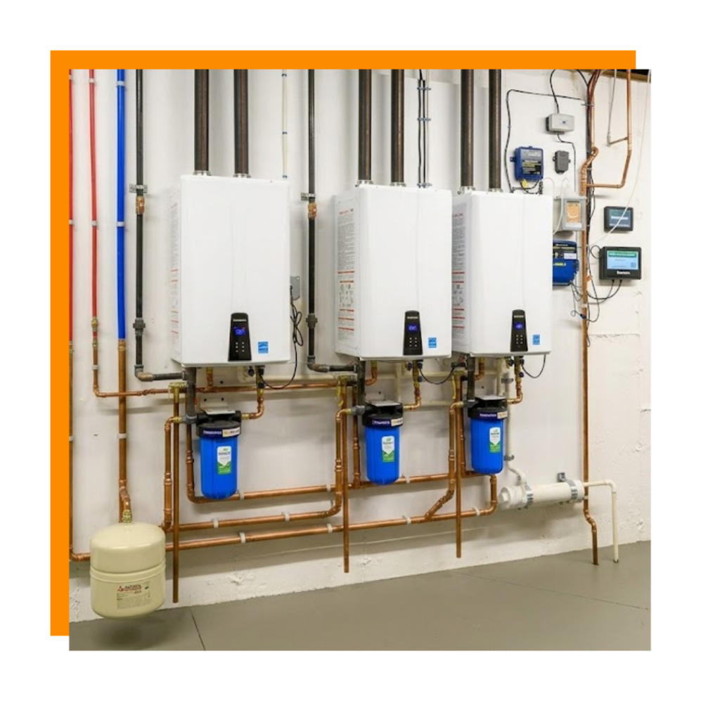 three tankless water heaters on wall