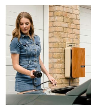Woman charging her EV vehicle
